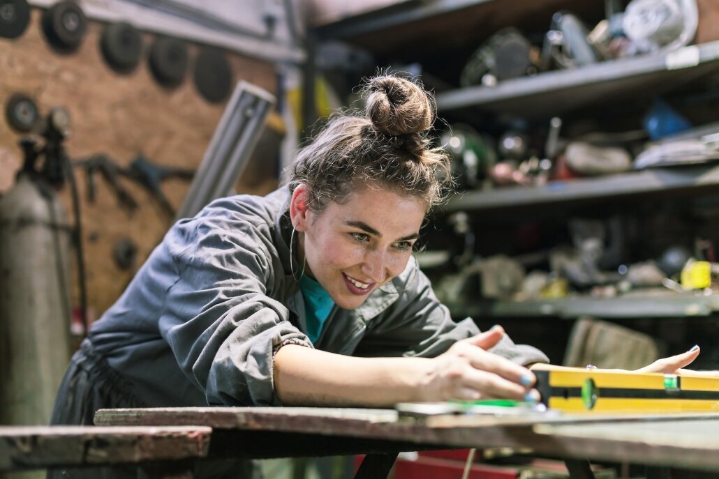 smiling_manual_worker_working_workshop